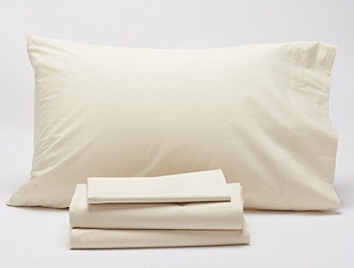 Stack of Coyuchi Sateen sheets, pillow case and pillow