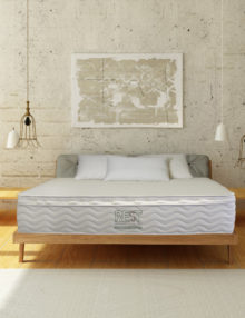 Display room with pale wooden finsihes and OMI Rossa Pocket Coil Organic Mattress