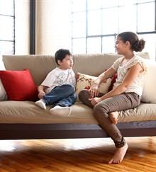 Two children sitting on display WLH Green Cotton and Wool Dreamton 5" Futon